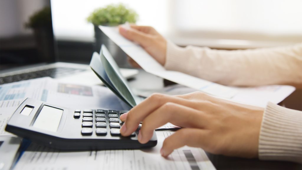 Woman calculating her Debt.